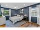 Comfortable primary bedroom with natural light, wood floors, and classic decor at 105 Dublin Dr, Lake Mary, FL 32746