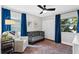 Cozy bedroom features a crib, rocking chair, and bright windows for natural light at 105 Dublin Dr, Lake Mary, FL 32746