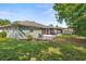 Charming exterior view of home with a well-maintained lawn, patio and screened-in porch perfect for outdoor enjoyment at 105 Dublin Dr, Lake Mary, FL 32746