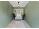 Inviting covered entryway with decorative plants and a stylish front door with glass detailing at 105 Dublin Dr, Lake Mary, FL 32746