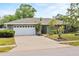 Charming single-story home with an attached two-car garage and well-manicured landscaping at 105 Dublin Dr, Lake Mary, FL 32746