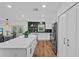 Bright and airy kitchen featuring an island, updated appliances, and seamless flow to the dining area at 105 Dublin Dr, Lake Mary, FL 32746