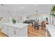 Spacious living room with hardwood floors, an open layout, and seamless flow from kitchen to Gathering room at 105 Dublin Dr, Lake Mary, FL 32746