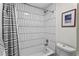Elegant bathtub shower featuring modern tile design and contemporary fixtures at 105 Dublin Dr, Lake Mary, FL 32746