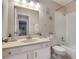 Bright bathroom featuring a vanity with a large mirror, white cabinetry, and a shower-tub combo at 1136 Villa Ln # 96, Apopka, FL 32712