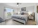 Comfortable bedroom with wood floors, a ceiling fan, and plenty of natural light at 1136 Villa Ln # 96, Apopka, FL 32712