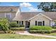 Charming home with well-manicured landscaping, a cozy entrance, and a neutral color palette at 1136 Villa Ln # 96, Apopka, FL 32712
