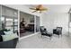Cozy lanai with tile flooring, a ceiling fan, and comfortable seating overlooking the interior living room at 1136 Villa Ln # 96, Apopka, FL 32712