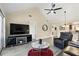 Spacious living area with a ceiling fan, recessed lighting, and a view into the kitchen at 1136 Villa Ln # 96, Apopka, FL 32712