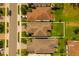 Birds eye view of home highlighting roof, driveway, and lawn on a sunny day in a residential area at 1151 Wildmeadow Run, Winter Park, FL 32792