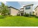 Expansive backyard featuring lush green lawn and professional landscaping at 1151 Wildmeadow Run, Winter Park, FL 32792