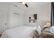 This bedroom features a neutral color palette and a closet with sliding doors at 1151 Wildmeadow Run, Winter Park, FL 32792