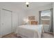 Cozy bedroom with a closet, ceiling fan, window with curtains, and neutral-colored walls at 1151 Wildmeadow Run, Winter Park, FL 32792