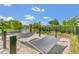 Relaxing hammock area surrounded by lush greenery and a serene ambiance next to the pond at 1151 Wildmeadow Run, Winter Park, FL 32792