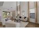 Bright open floor plan of the living room with high ceilings and large windows at 1151 Wildmeadow Run, Winter Park, FL 32792
