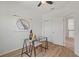 Bright office space with wood floors, a glass top desk, and a large window at 1151 Wildmeadow Run, Winter Park, FL 32792