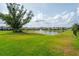 Scenic pond view with a fountain and lush landscaping at 1151 Wildmeadow Run, Winter Park, FL 32792