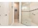Bright bathroom showcasing a walk-in shower with tiled walls and glass door at 1265 Zeek Ridge St, Clermont, FL 34715
