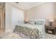 Well-lit bedroom features a comfortable bed, side tables, and a closet, creating a relaxing space at 1265 Zeek Ridge St, Clermont, FL 34715