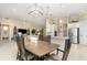 Inviting dining area with an open view to the living room and kitchen, perfect for modern living and entertaining at 1265 Zeek Ridge St, Clermont, FL 34715