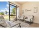 Enclosed patio featuring comfortable seating and views of the landscaped backyard, perfect for relaxation at 1265 Zeek Ridge St, Clermont, FL 34715