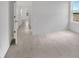 Bedroom featuring a window with a view of the outdoors and a hallway at 12863 Harvest Rain Ave, Winter Garden, FL 34787