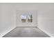 Bright bedroom featuring two windows offering natural light and outdoor views at 12863 Harvest Rain Ave, Winter Garden, FL 34787