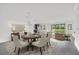 Dining room features a round table, chandelier lighting, and an open floorplan at 12863 Harvest Rain Ave, Winter Garden, FL 34787