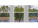 Windows with a view of trees and water at 12863 Harvest Rain Ave, Winter Garden, FL 34787
