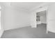 Empty bedroom with connecting doorway to kitchen showing open concept design with light paint at 12869 Harvest Rain Ave, Winter Garden, FL 34787