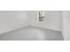 Neutral bedroom with tile floors, one window and white walls at 12869 Harvest Rain Ave, Winter Garden, FL 34787