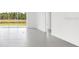 Sun-lit empty bedroom showing lake view with lots of natural light, light paint, and tile floors at 12869 Harvest Rain Ave, Winter Garden, FL 34787