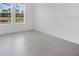Bedroom with a tranquil view overlooking lush greenery through two windows at 12869 Harvest Rain Ave, Winter Garden, FL 34787
