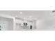 Bright kitchen features white cabinets, stainless steel appliances, a marble backsplash and a large countertop at 12869 Harvest Rain Ave, Winter Garden, FL 34787