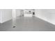 Open-concept living room boasts tile floors and lots of natural light from adjacent room at 12869 Harvest Rain Ave, Winter Garden, FL 34787