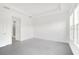 Bright main bedroom with neutral walls, tile floors, tray ceiling, and large windows at 12869 Harvest Rain Ave, Winter Garden, FL 34787