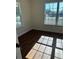 A bedroom with vinyl plank floors, a large window, and neutral walls at 1310 Polk City Rd, Haines City, FL 33844