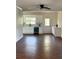 Bright open-concept kitchen with modern appliances, white cabinets, and sleek countertops blending with the dining area at 1310 Polk City Rd, Haines City, FL 33844