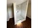A modern shower features stylish tiling, a shower head, and updated hardware at 1310 Polk City Rd, Haines City, FL 33844
