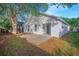 View of the backyard with a concrete patio and an exterior of the house at 13216 Wild Duck Ct, Orlando, FL 32828