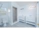 Bright bathroom features dual vanity sinks and a walk-in shower with modern tile at 13216 Wild Duck Ct, Orlando, FL 32828