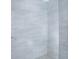 Close-up of the modern shower with attractive neutral colored tiling at 13216 Wild Duck Ct, Orlando, FL 32828