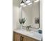 Modern bathroom featuring a vessel sink, stylish faucet, a black framed mirror and chic decor at 13430 Early Frost Cir, Orlando, FL 32828
