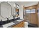 Modern bathroom featuring a double vanity with vessel sinks and a glass-enclosed shower at 13430 Early Frost Cir, Orlando, FL 32828