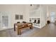Dining area with wooden table, bench seating, and access to a staircase and exterior door at 13430 Early Frost Cir, Orlando, FL 32828