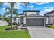Beautiful two-story home with manicured lawn and landscaping plus a two car garage at 13430 Early Frost Cir, Orlando, FL 32828