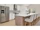 Well-equipped kitchen with stainless steel appliances, island with bar seating, and ample counter space at 13430 Early Frost Cir, Orlando, FL 32828