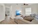 Cozy living room with comfortable seating, a TV, and a large window for natural light at 13430 Early Frost Cir, Orlando, FL 32828