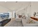 Open floor plan with living room, dining area, and kitchen offering plenty of natural light at 13430 Early Frost Cir, Orlando, FL 32828