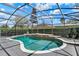 Screened in pool features clear blue water and an attached spa with room for entertaining at 13430 Early Frost Cir, Orlando, FL 32828